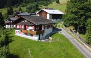 a house on a hill next to a road at Charming Louisa Zimmer Roof - KEINE KÜCHE in Rueras