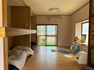 Postel nebo postele na pokoji v ubytování 猫と泊まれる宿にゃんstay