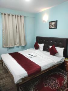 Postel nebo postele na pokoji v ubytování Hotel Pearl Retreat