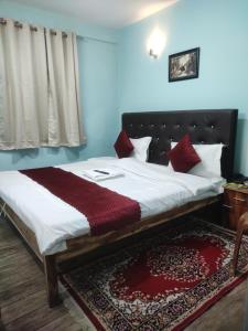 Postel nebo postele na pokoji v ubytování Hotel Pearl Retreat