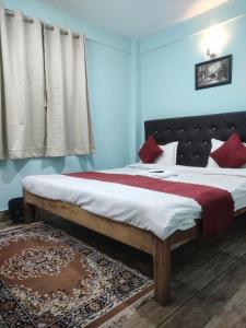Postel nebo postele na pokoji v ubytování Hotel Pearl Retreat