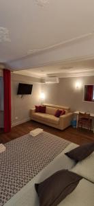 a living room with a couch at B&B Italian Guest Genova in Genoa