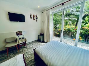 TV a/nebo společenská místnost v ubytování Hoang Phuc resort