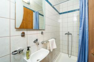 a bathroom with a sink and a shower and a mirror at Casa Claudia in Zaton +19 photos