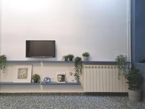 TV a/nebo společenská místnost v ubytování Studio MAXIM