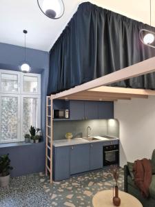 Kuchyň nebo kuchyňský kout v ubytování Studio MAXIM