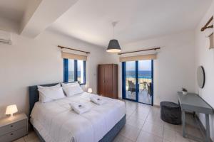 Postel nebo postele na pokoji v ubytování Diana Seaside Villas
