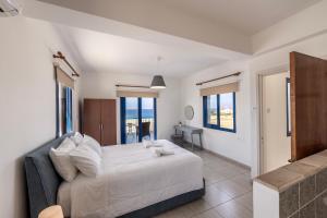 Postel nebo postele na pokoji v ubytování Diana Seaside Villas