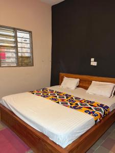 Postel nebo postele na pokoji v ubytování DG Hôtel