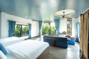 Postel nebo postele na pokoji v ubytování Phúc Villa Hoi An