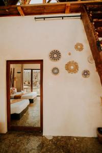 a room with two beds and plates on the wall at NYLA Boutique Resort Siargao in General Luna