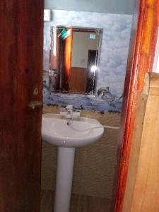 a bathroom with a sink and a mirror at The paulwood cabana and Bungalow in Nuwara Eliya +26 photos