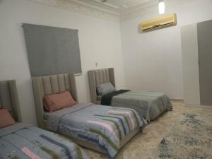 A bed or beds in a room at Lifespans resort منتجعات عمر