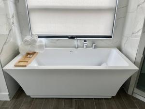 a white sink in a bathroom with a mirror at Beach House with Rooftop Jacuzzi in Huntington Beach +61 photos
