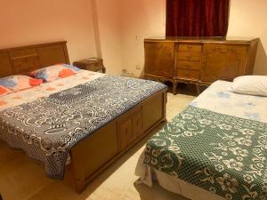 A bed or beds in a room at Jamila cosy apartment