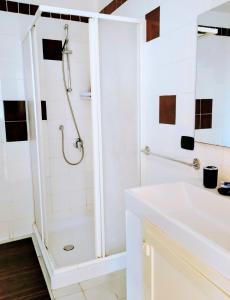 a white bathroom with a shower and a sink at Black Stone in Pompei +17 photos