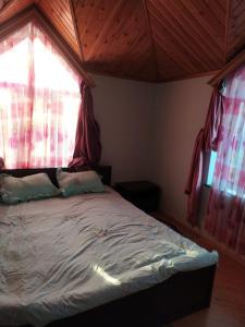 Postel nebo postele na pokoji v ubytování Дом