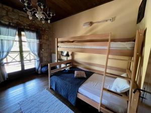 a bedroom with two bunk beds in a room at Villa Rokosini in Vourvourou