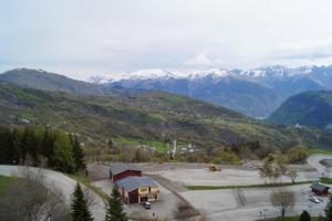 an aerial view of a mountain with snow capped mountains at Le Corbier Soyouz Vanguard in Le Corbier +1 photo