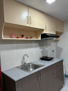 a kitchen with a sink and a counter top at Solana Tower 1 New and Very Neat Studio Unit near SM Manila in Manila +3 photos