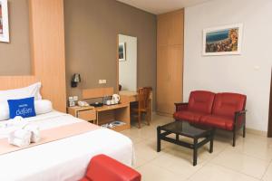 Ένα ή περισσότερα κρεβάτια σε δωμάτιο στο Hotel Dafam Rio