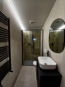 a bathroom with a shower and a sink and a mirror at Maria Home - MILANO BOVISA POLITECNICO in Milan
