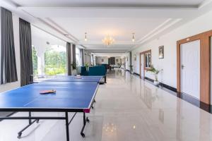 a row of ping pong tables in a hallway at BA-NA Hills Resort in Salara