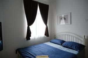 Postel nebo postele na pokoji v ubytování Homestay Bukit Mertajam - DHome