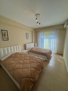 Postel nebo postele na pokoji v ubytování Shkodra Apartment