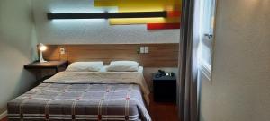 Postel nebo postele na pokoji v ubytování Hotel 10 Uniao da Vitoria
