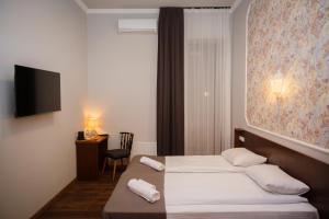 Letto o letti in una camera di Tea for Two Hotel