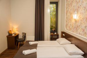 Letto o letti in una camera di Tea for Two Hotel