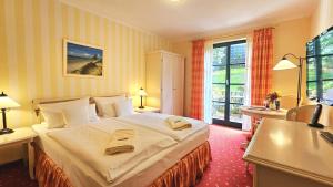 Postel nebo postele na pokoji v ubytování Hotel Godewind
