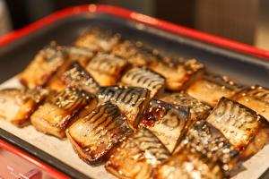a tray of chinese food on a table at HOTEL GLOBAL VIEW Morioka in Morioka