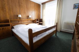 Posteľ alebo postele v izbe v ubytovaní Hotel Tanecnica