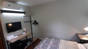 Postel nebo postele na pokoji v ubytování Hotel 10 Uniao da Vitoria