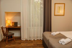 Letto o letti in una camera di Tea for Two Hotel