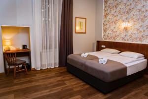 Postel nebo postele na pokoji v ubytování Tea for Two Hotel