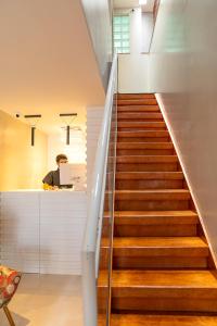 a staircase with wooden steps leading up to a room at Pousada Capua Buzios in Búzios +34 photos