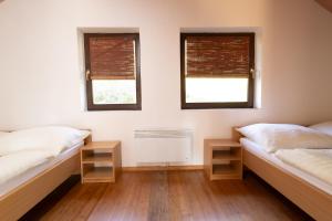 Postel nebo postele na pokoji v ubytování Bungalovy-Pustevny