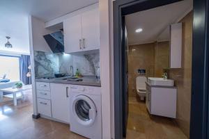 Kuchyň nebo kuchyňský kout v ubytování İlya Apart 2 + 29 fotografií