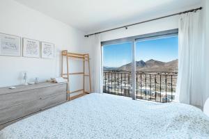 a bedroom with a bed and a large window at Elegant Villa Private Pool & Stunning Views in Bodrum City +55 photos