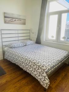 Ένα ή περισσότερα κρεβάτια σε δωμάτιο στο SteR Appartement Zandvoort