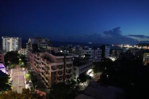 a view of a city at night with buildings at Akshayaa Grand in Visakhapatnam