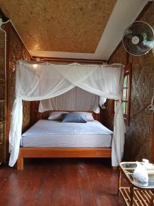 Postel nebo postele na pokoji v ubytování Mook Bamboo Bungalows