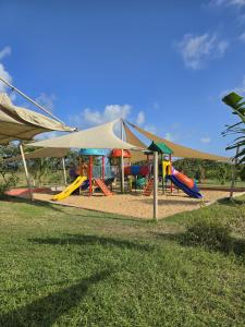 a park with a playground with a tent at The Vipingo Retreat in Vipingo