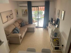 TV a/nebo společenská místnost v ubytování Dúplex, terraza y vistas al mar