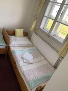Postel nebo postele na pokoji v ubytování Chata Maxe Švabinského