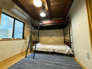 Postel nebo postele na pokoji v ubytování すくもBOX guesthouse