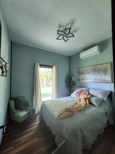 a bedroom with a large bed and a window at Life's Good Friends Retreat in Brevard +24 photos